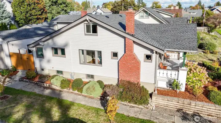 This charming home is located on a corner lot, the building opposite the left of the fence is a BIG SHOP!