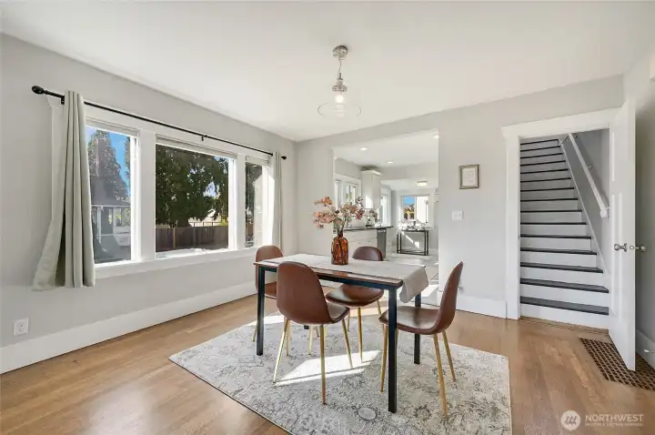 The dining room can accommodate a much larger dining set. The big windows really brighten up the room.
