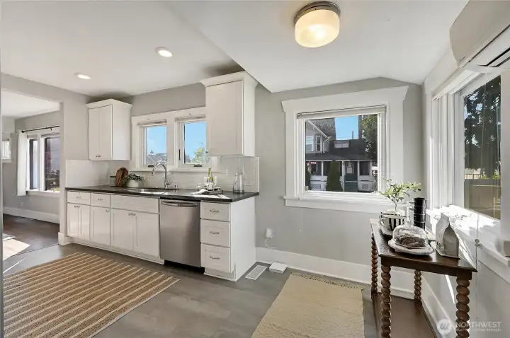 The kitchen has a nice coffee nook with corner windows.