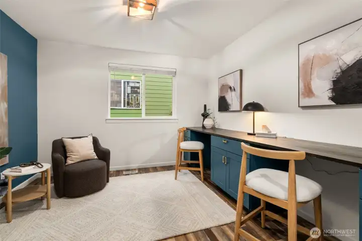 The home office has built in desks ready to tackle any project.