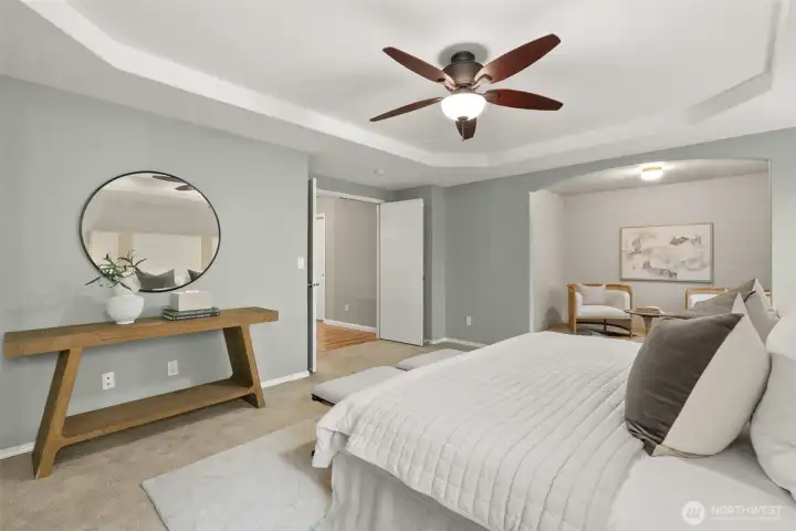 You're greeted to the primary suite by double entry doors.