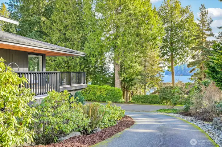 Peek-a-boo water views are evident from most of the rooms throughout the house. New paint, updated landscape, and a huge remodel inside and just the start of the updates in the stunning home.