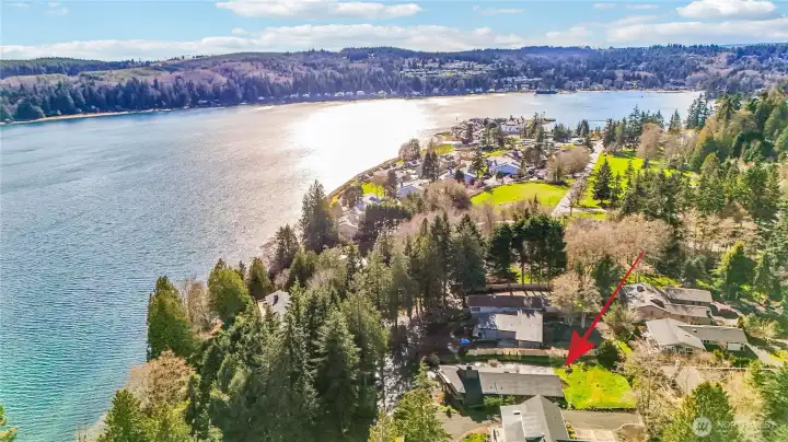 Red arrow points to 192 Condon Lane. Trails connect you to the Beach Clubhouse, pickleball courts, gym, Inn and Fireside Restaurant at Port Ludlow and the 300-slip marina in the background.