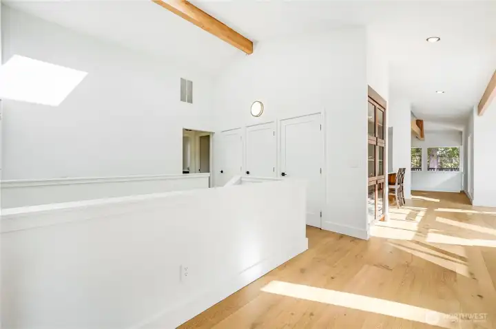 The whole house has new light oak Engineered floors, completely remodeled kitchen, re-stained beams, rebuilt cherry cabinets on the right, updated lighting, new roof, new exterior paint, and much more.