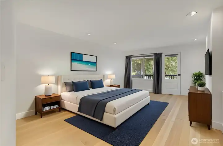 The primary main level bedroom has deck access, and on the right-hand side of the wall is access to hook up a wood-burning fireplace if desire.  All new light oak engineered hardwood and wall closets are on the right.