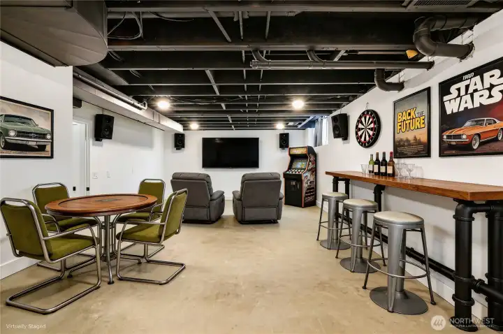Once an unused room, the sellers have painted the ceiling and turned this furnace room into a game room. This virtual staging shows one way you can use this flex room, and it's fun!