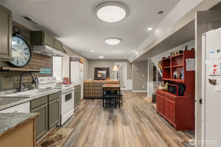 Functional basement kitchen with open living space—ideal for guests or extended living.