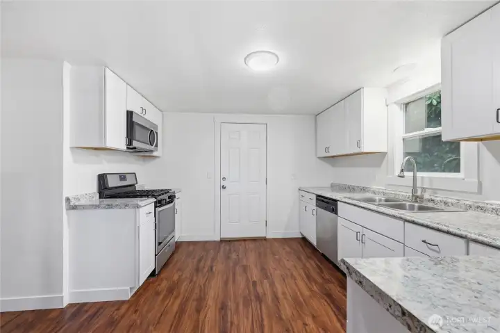 Large ktichen with stainless steel appliances