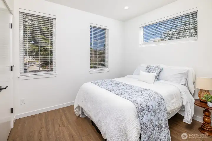 Second top floor bedroom, slightly smaller than primary ensuite, but still large enough to fit a queen bed comfortably. **staged unit B**