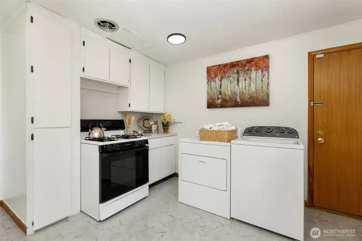 The washer & dryer conveniently located in the kitchen
