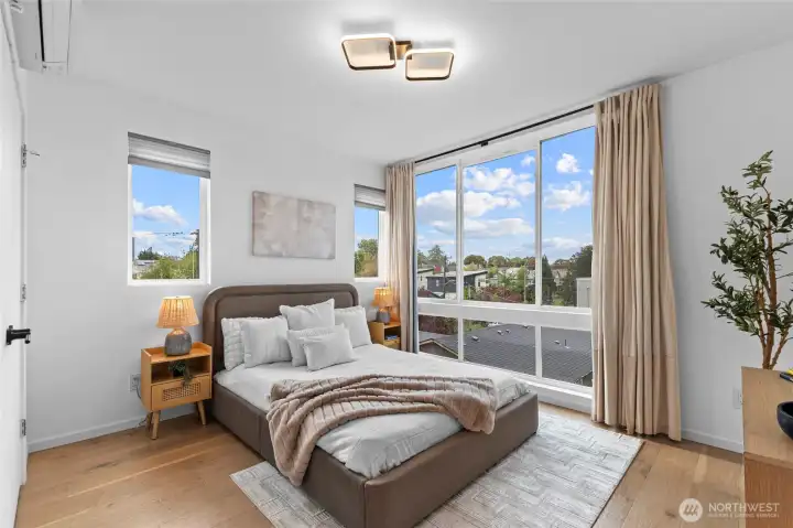 Primary bedroom with lots of natural light