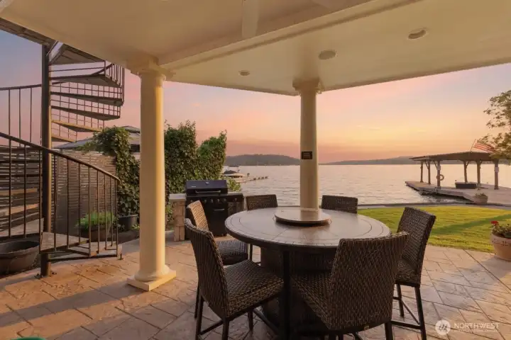 Covered patio leads right to the lake