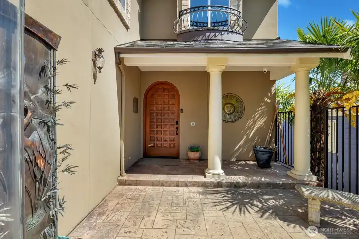 Walk inside the gated entry to your custom front door
