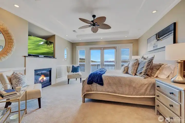 Primary bedroom, fireplace, french doors onto deck