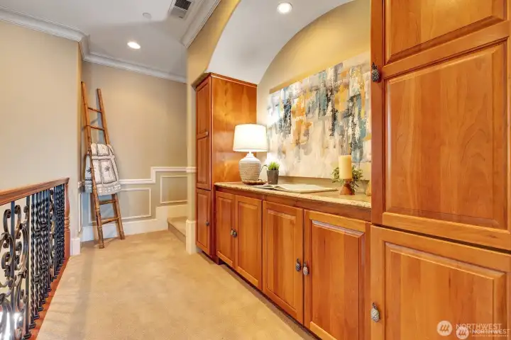 Hall entry with matching cabinets and pullouts