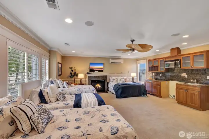 Bunkroom with microwave, sink, undercounter refrigerator, fireplace and 220 hook-up