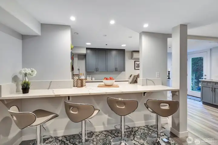 Bar seating, quartz counter top with waterfall finishes