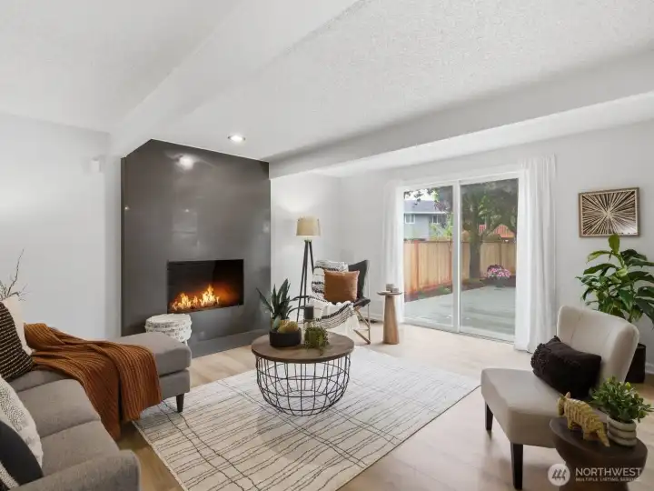 Cozy on up to the jaw-dropping quartz fireplace on chilly nights or catch a nice breeze from the sliding glass door during the warm days ahead. Cozy on up to the jaw-dropping quartz fireplace on chilly nights or catch a nice breeze from the sliding glass door during the warm days ahead.