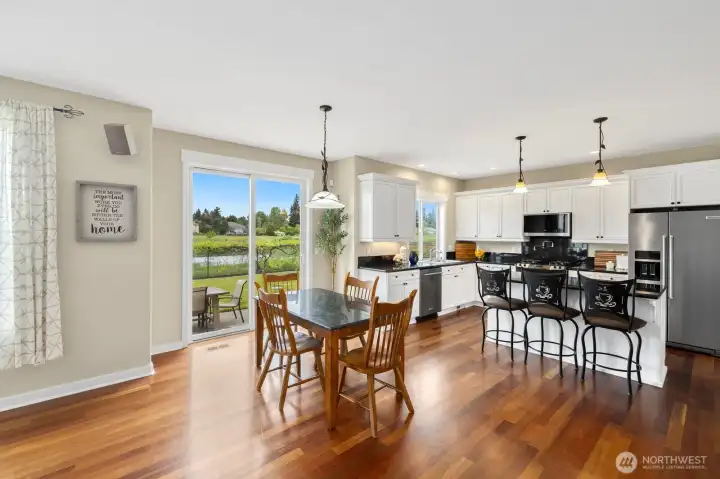 Access from kitchen to fully fenced back yard, patio and firepit!  Enjoy the privacy and views!