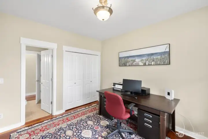 Office off entry way with closet and ATTACHED 3/4 BATH!  Easily converts to main floor bedroom.