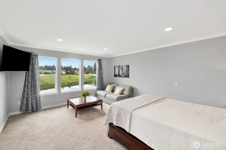 Generously sized upstairs primary suite with stunning views and sitting area!