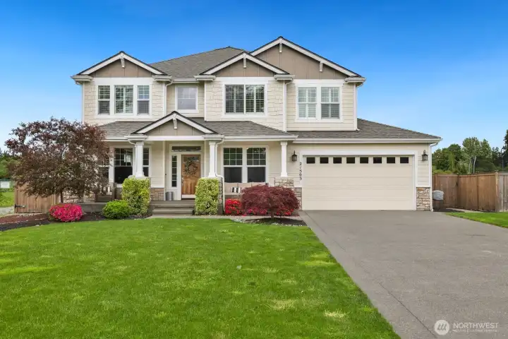 Great curb appeal, mature landscape and TANDEM garage.