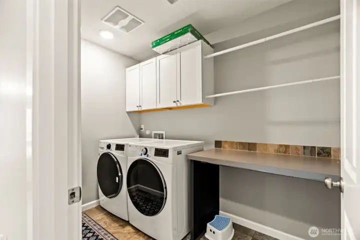 Laundry room with folding station and lots of storage.