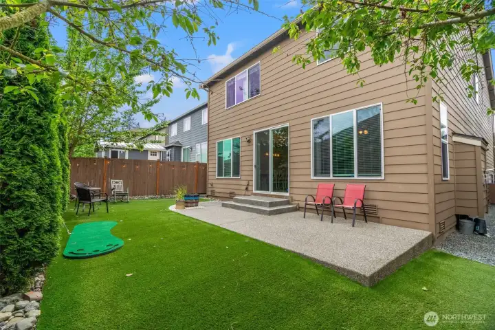 Fully fenced rear yard with low-maintenance turf.