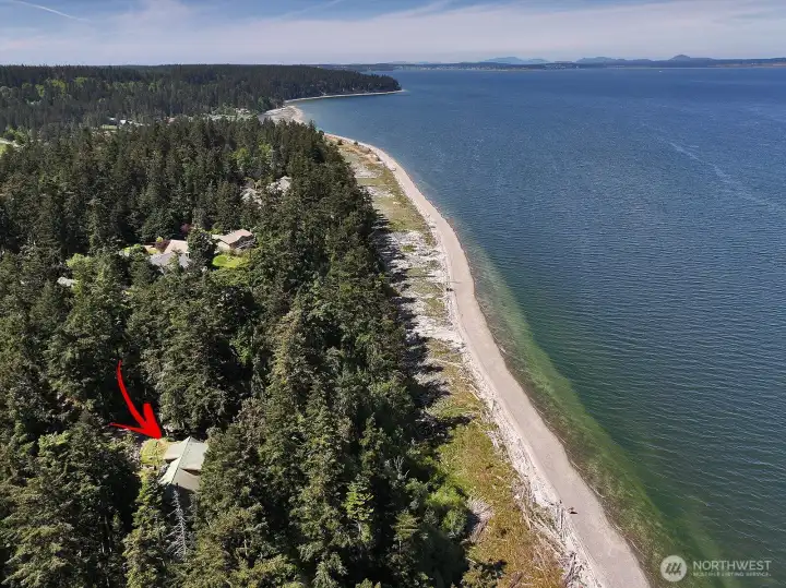 Almost 3 acres with 170 +/- ft of waterfront with your own stairs/trail to the beach! Look at all that beach to explore!