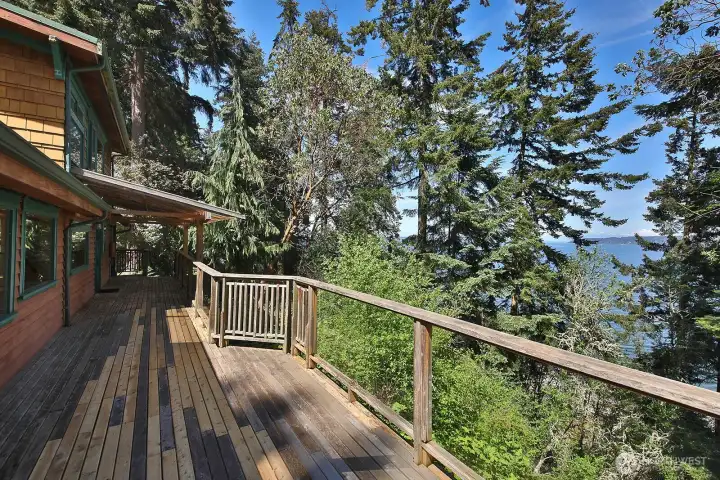 Generous front deck spans the entire waterside of the home. Deck has been recently repaired. Cedar sided exterior. There is even a covered portion of your deck that wraps around to the side of the home.