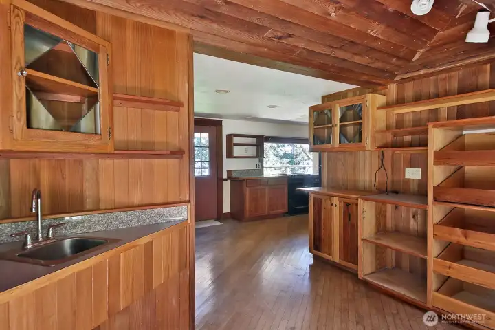 Upon entry, take a moment to look up and around. Notice all the detail and thoughtfulness that went into the built-in shelving and cabinetry. So much history here. Come and make this one yours, with your own creative ideas.