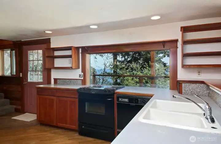 Custom cherry cabinets are in good condition. How bout the view you have when cooking!