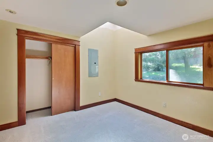 This is the bedroom closest to the kitchen. It is one of two main level bedrooms.  It has it's own skylight, and also has newer carpet.