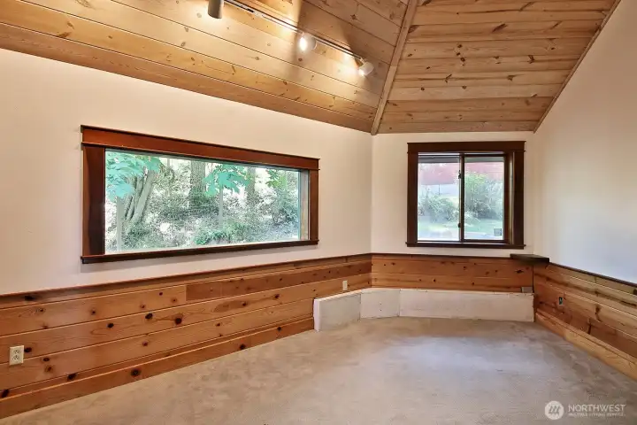 This is the second main level bedroom. Also with newer carpet. You can see a glimpse of the shop outside the window straight ahead.