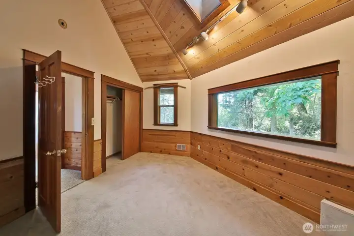 Solid wood doors. The bathroom is directly across from this bedroom.