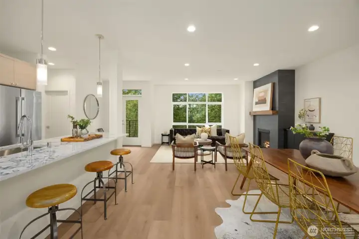 Look across the open-concept layout toward the beautifully appointed chef's kitchen, perfect for keeping the conversation flowing.