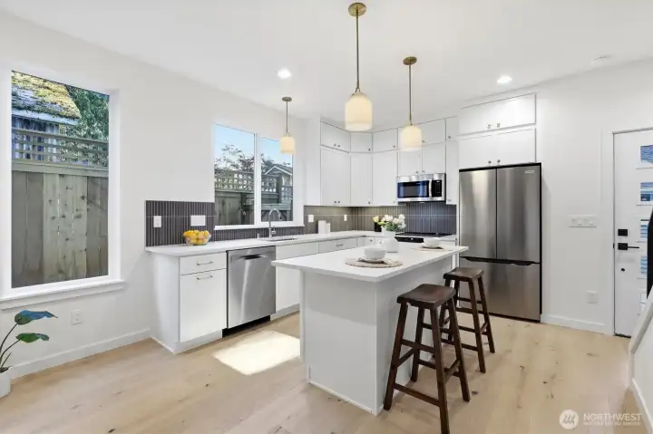 Light and bright kitchen with large center island. Light and bright kitchen with large center island.