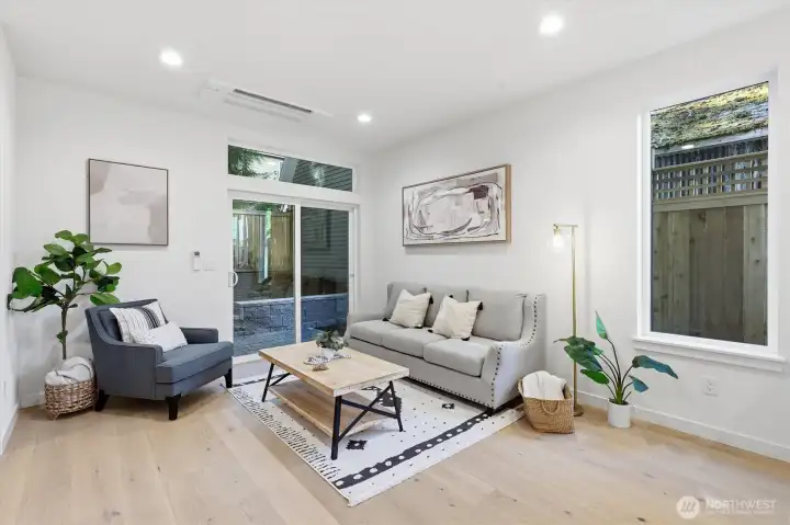 Spacious living room off the kitchen with slider to back patio. Spacious living room off the kitchen with slider to back patio.