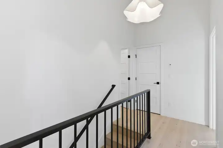 Nice railing and the engineered hardwoods continue upstairs. Nice railing and the engineered hardwoods continue upstairs.