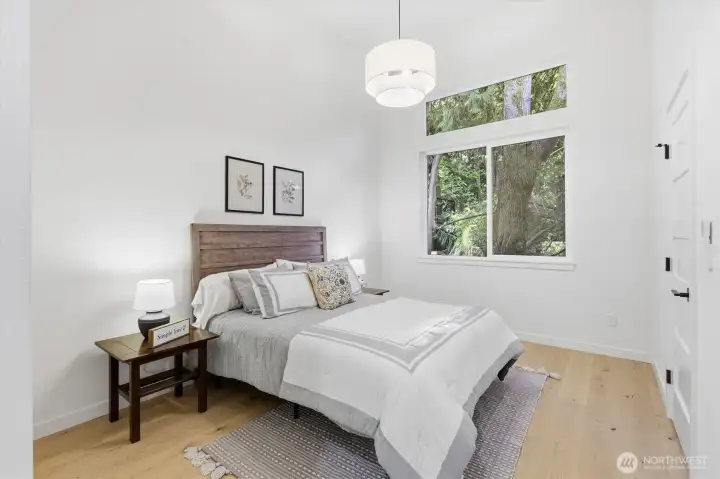 Primary suite has vaulted ceilings and private sight lines out the window. Primary suite has vaulted ceilings and private sight lines out the window.