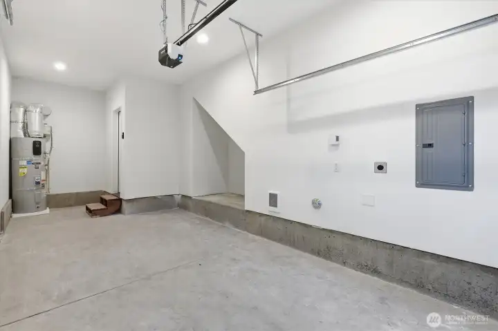Extra deep with cut out under stairs to provide plenty of space in the garage. The high ceilings could allow for even more vertical storage. Extra deep with cut out under stairs to provide plenty of space in the garage. The high ceilings could allow for even more vertical storage.