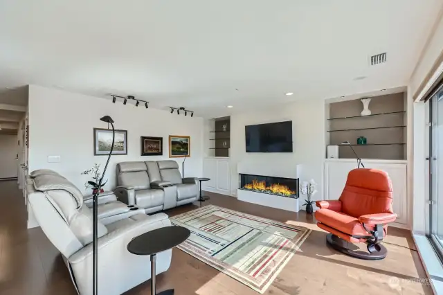 The generous livingroom includes built-ins and a new linear fireplace.