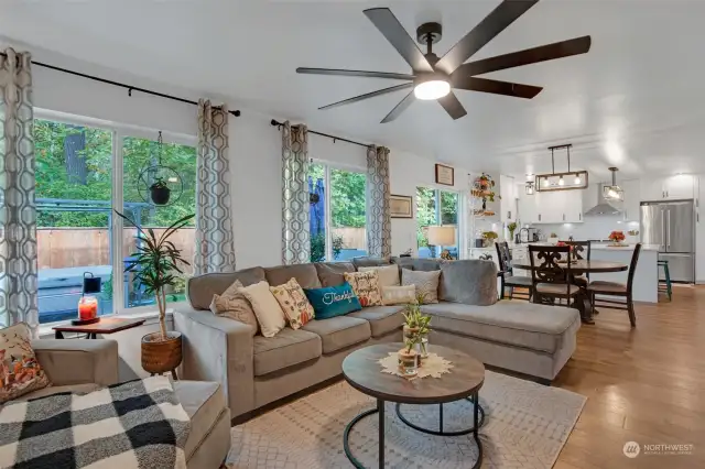 Open concept flow between the family room and the kitchen with direct access to the deck.