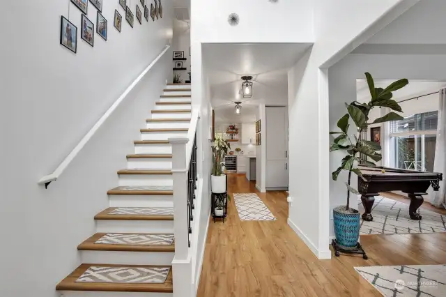 Stairs off the entry lead to the upper level with 4 bedrooms and 2 full bathrooms.