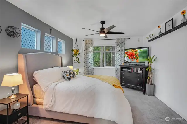 A ceiling fan in the primary bedroom provides added comfort.