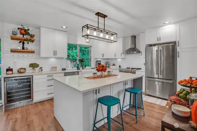 So much to love in this kitchen with an abundance of cabinetry and a center island with eating bar.