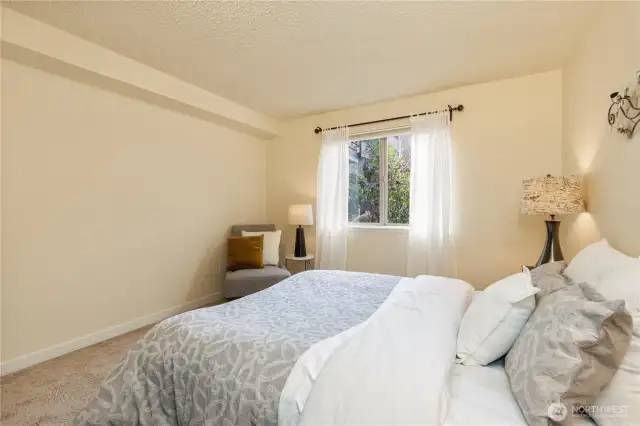 The fresh paint continues for a serene bedroom.
