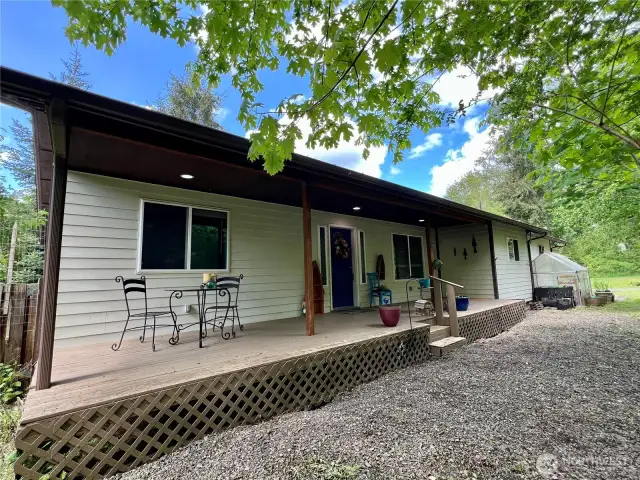 Back view of the home. The small green house does not convey and will be removed before closing.