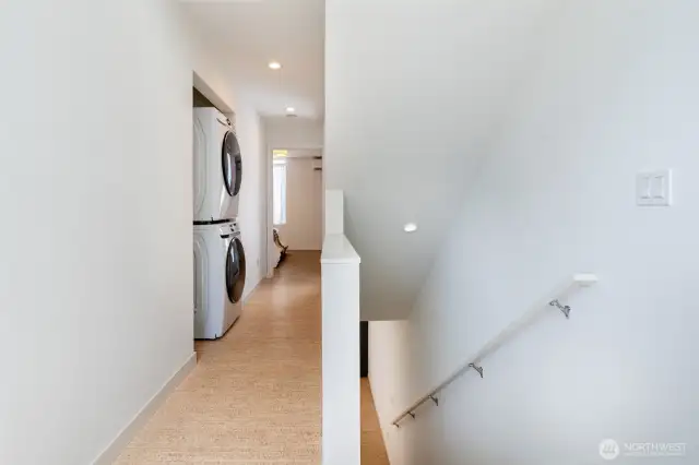 Full size stackable washer/dryer on your way to the primary bedroom