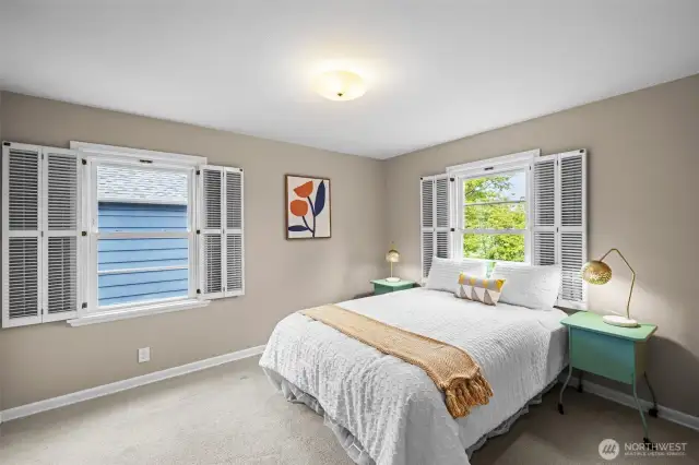 Spacious bedroom, wood shutters